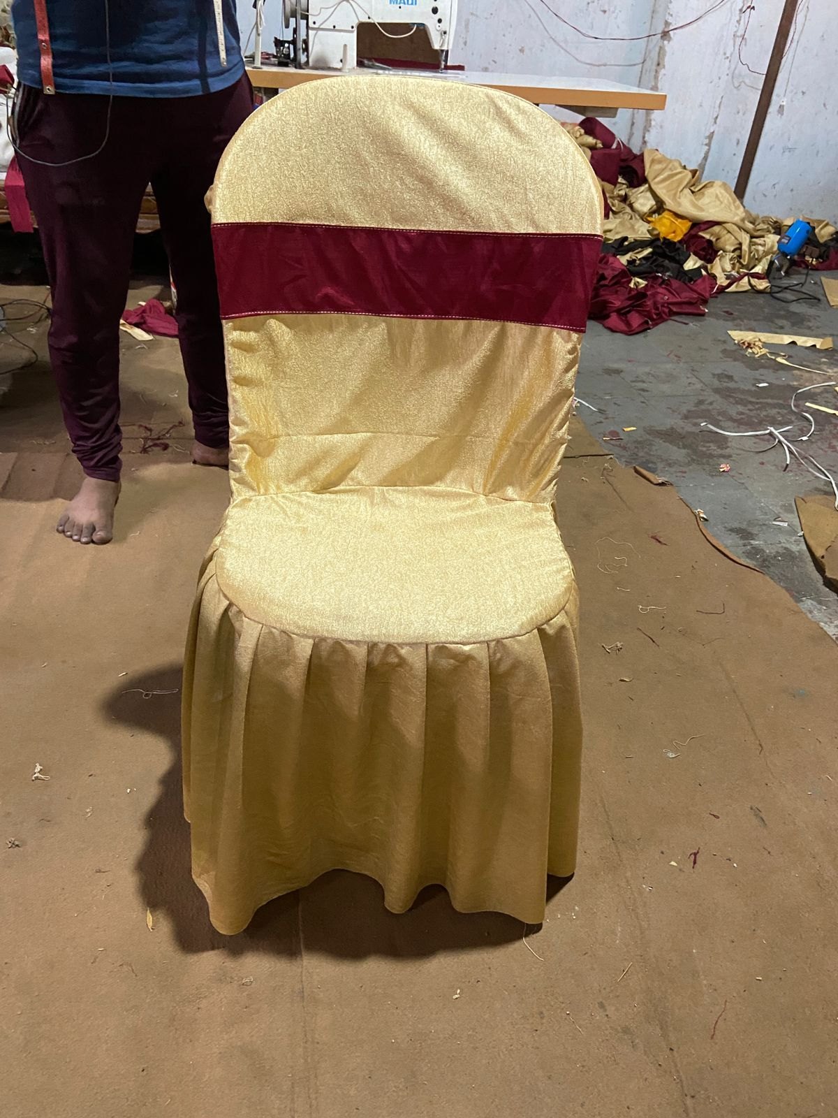 67792efb4d772-Chandani_Chair_Cover_2853994047112_chair-cover-golden-with-frill-with-mehroon-patti-on-back.jpg